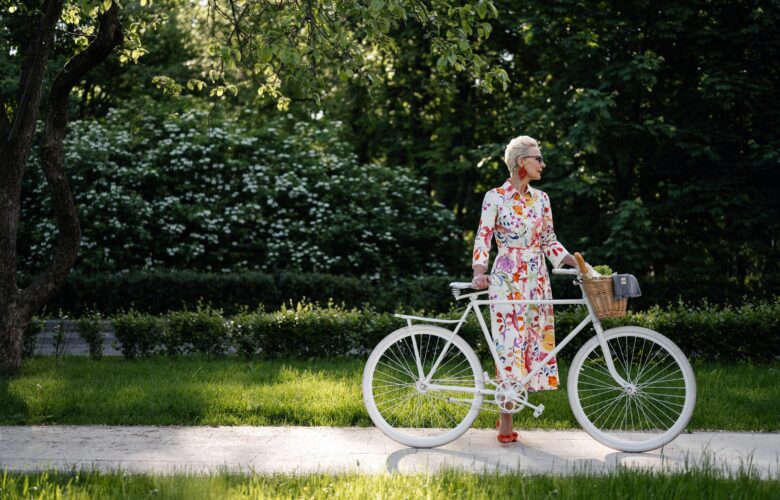 Fashionable senior woman with bicycle