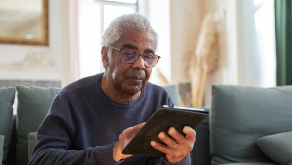 Senior on tablet