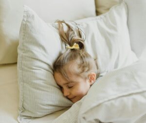 Child in comfortable bed